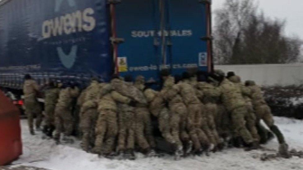 Soldiers pushing a lorry in the snow at Magor