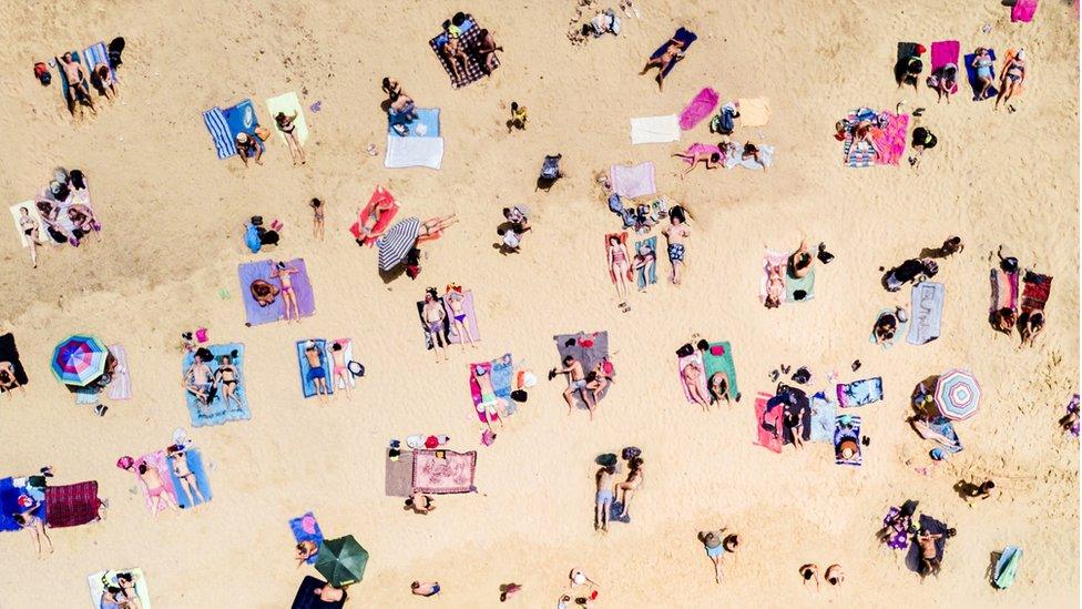 holidaymakers on beach