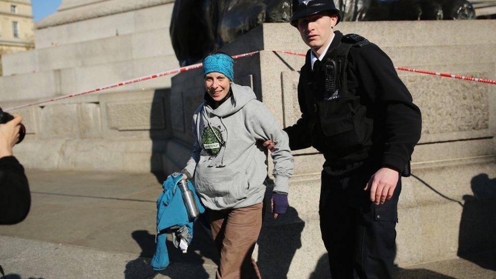 Greenpeace activist Alison Garrigan was arrested after climbing Nelson's Column in Trafalgar Square