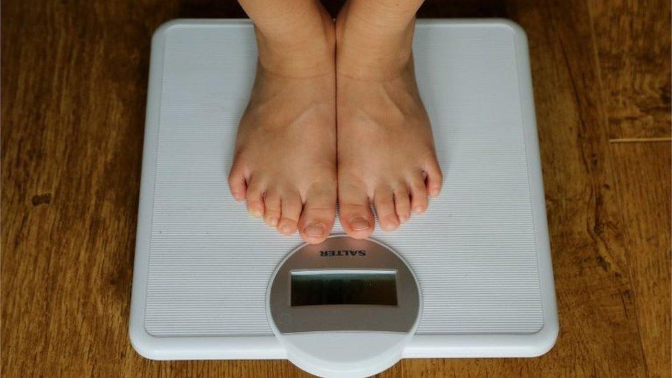 Child's feet on scales