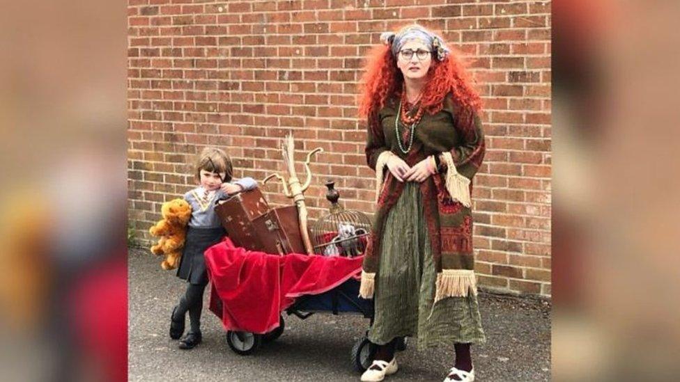 Mother and daughter in fancy dress out on walk