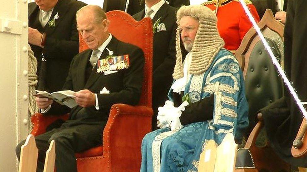 Prince Phillip sitting next to Tynwald President Noel Cringle on Tynwald Hill