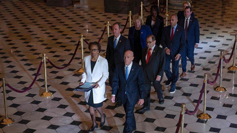 House Managers walk to the US Senate to deliver the Articles of Impeachment against US President Donald Trump on Capitol Hill on January 15, 2020, in Washington, DC