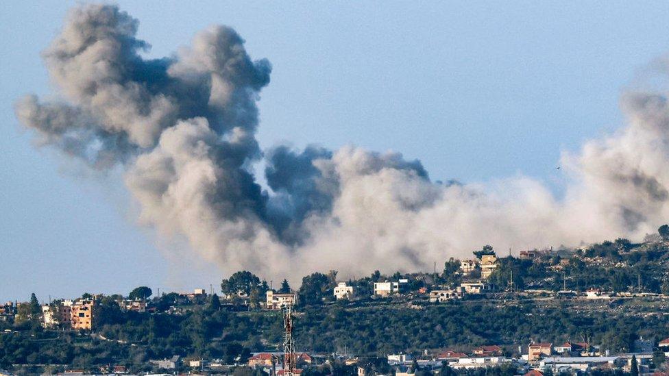 This picture taken from a position along the border in northern Israel on December 26, 2023 shows smoke billowing in the southern Lebanese village of Marwahin following Israeli bombardment amid ongoing cross-border tensions as fighting continues between Israel and Hamas militants in the Gaza Strip