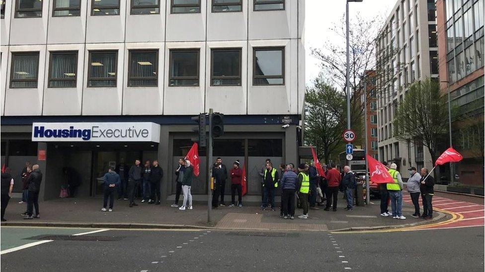 Workers outside Housing Executive