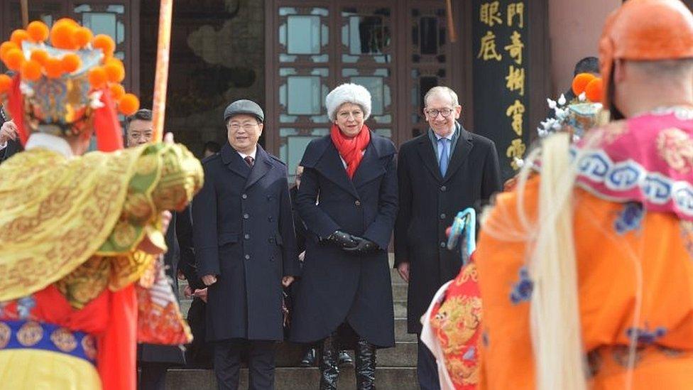 Theresa May and husband Philip watch a Peking Opera performance in Wuhan