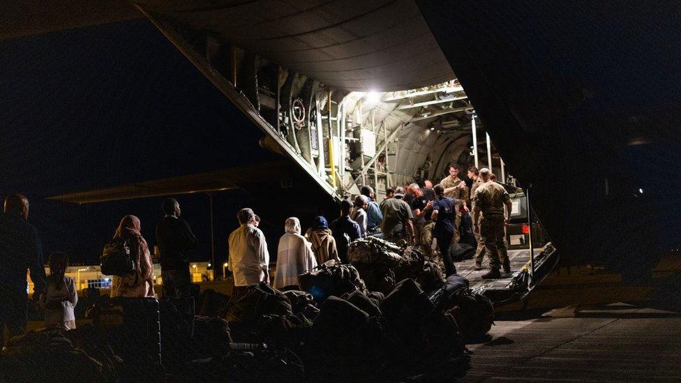 People boarding the RAF flight in Sudan