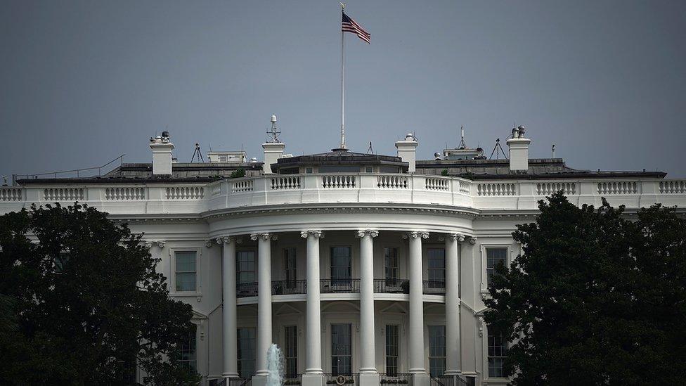 The White House flag flies at full-staff two days after John McCain's death.