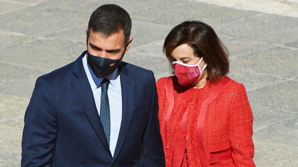 Prime Minister Pedro Sanchez and Defence Minister Margarita Robles attend the National Day Military Parade at the Royal Palace on October 12, 2020