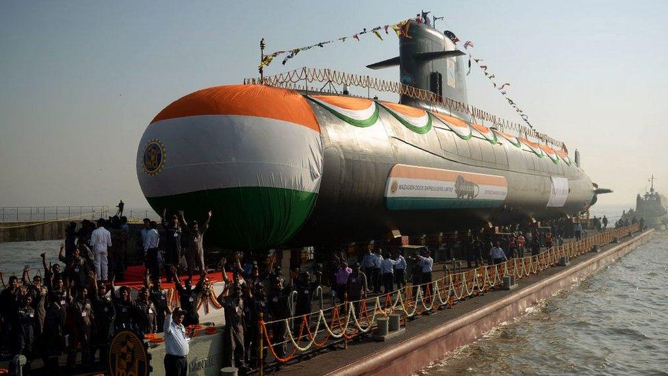 The Indian Navy's third Scorpene-class submarine, Karanj, is pulled into the Arabian Sea after its launch ceremony at the Mazagon Dock Shipyard in Mumbai on January 31, 2018