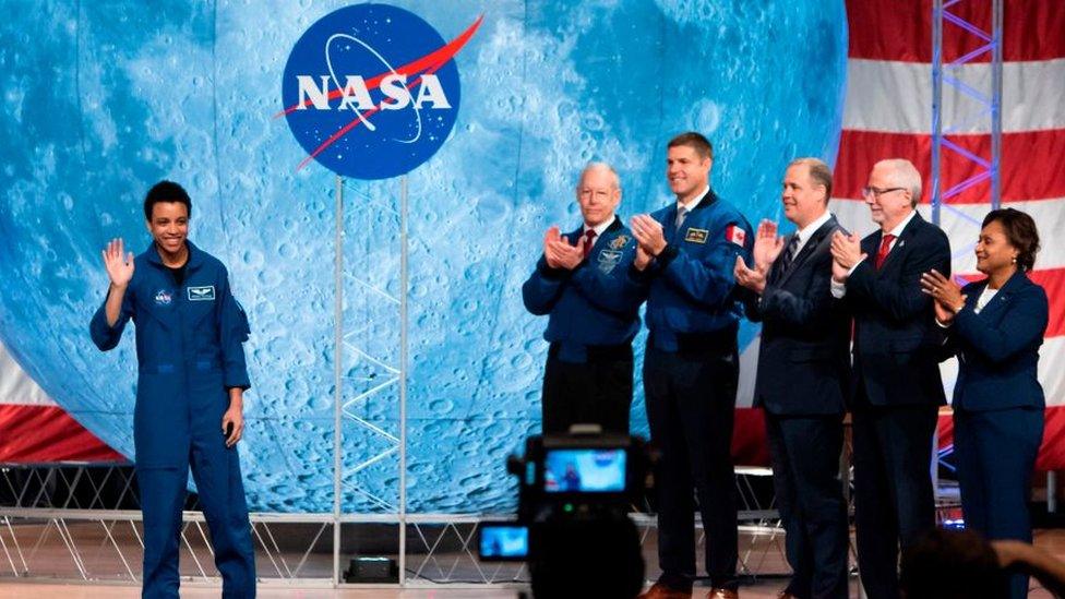 NASA astronaut Jessica Watkins waves at the audience during during the astronaut graduation ceremony