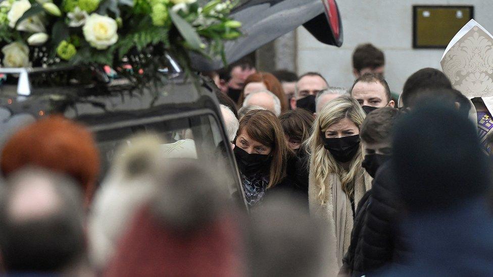 Mother and sister of the late 23-year-old teacher, Ashling Murphy, who was murdered while out jogging, stand outside the St Brigid"s Church in Mountbolus near Tullamore, Ireland January 18, 2022. REUTERS/Clodagh Kilcoyne