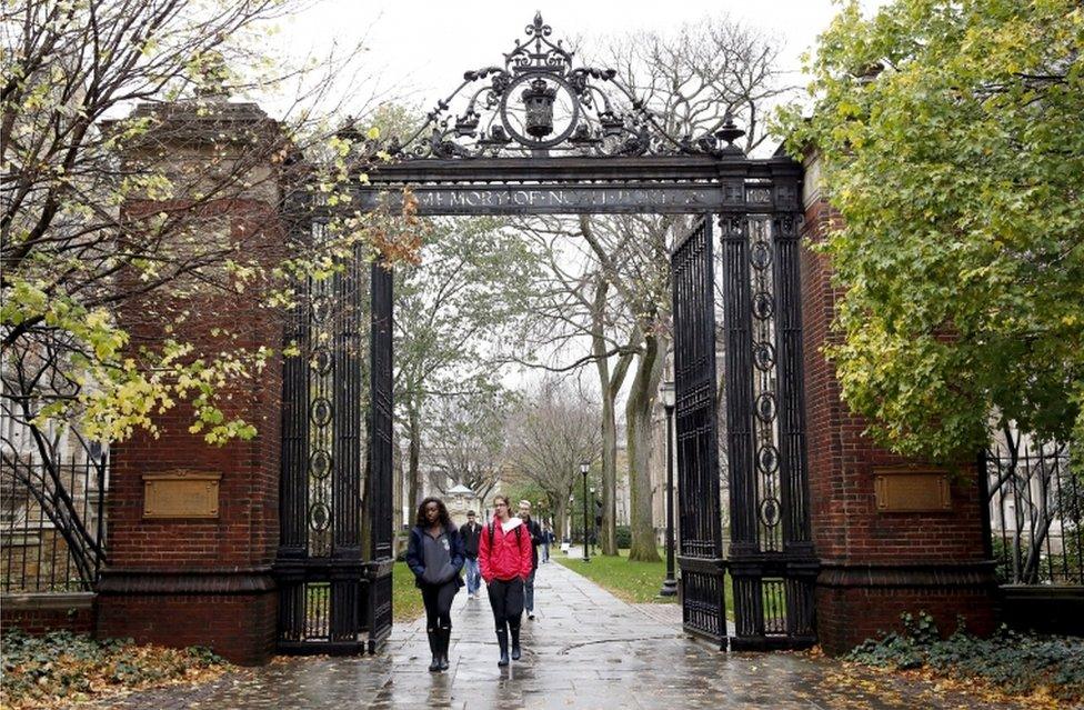 Students walk on the campus of Yale University in New Haven, Connecticut