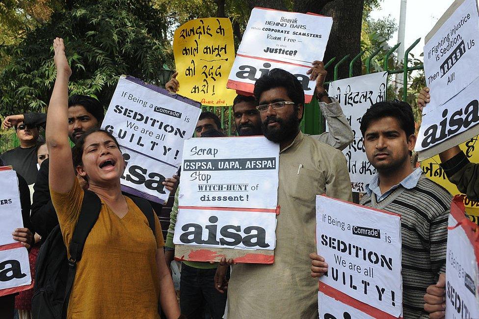 Indian college lecturers, teachers and political activists hold placards as they shout anti-government slogans in New Delhi on February 12, 2011 during a protest against the life sentence handed down to doctor and social activist, Binayak Sen, on charges of sedition in India's Chhattisgarh state. Amnesty International has described Binayak Sen as a 'prisoner of conscience' but the court insisted the doctor helped outlawed Maoist guerrillas in the insurgency-riven state. An Indian court on February 10 refused bail for Sen sentenced to life in prison on charges of helping Maoist insurgents, in a case that has drawn international condemnation.