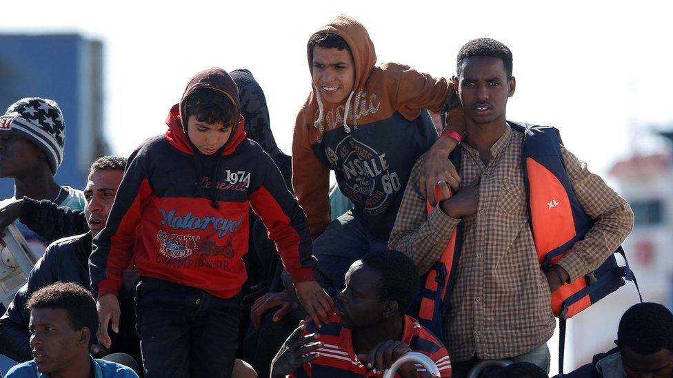 Migrants arrive in Sicily on Italian coastguard vessel - 13 May