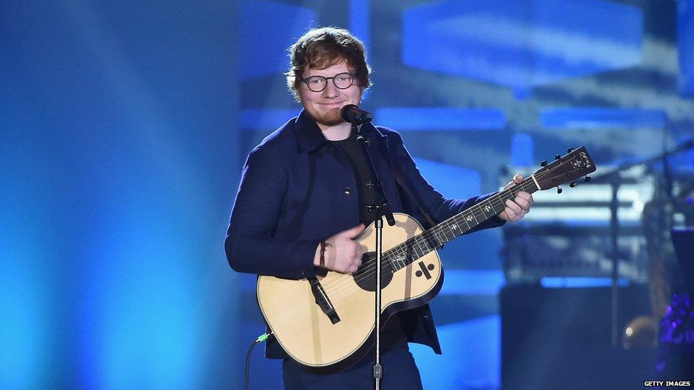 Ed Sheeran performing on stage