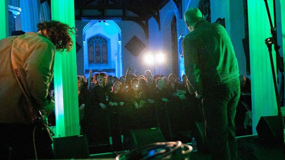 TV Priest performing at the former church