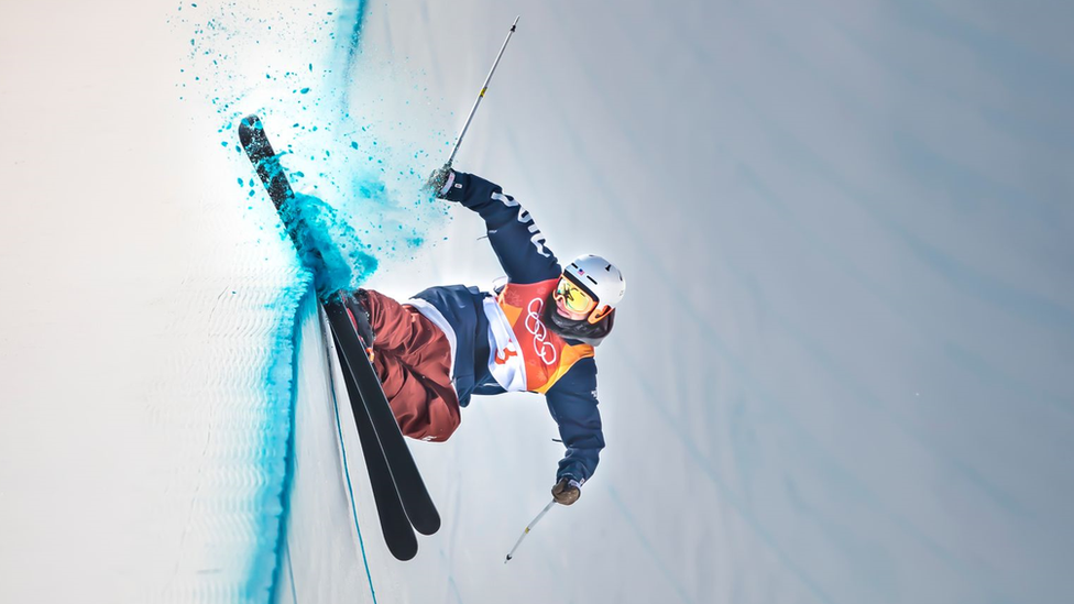 A skier in a wall of snow.