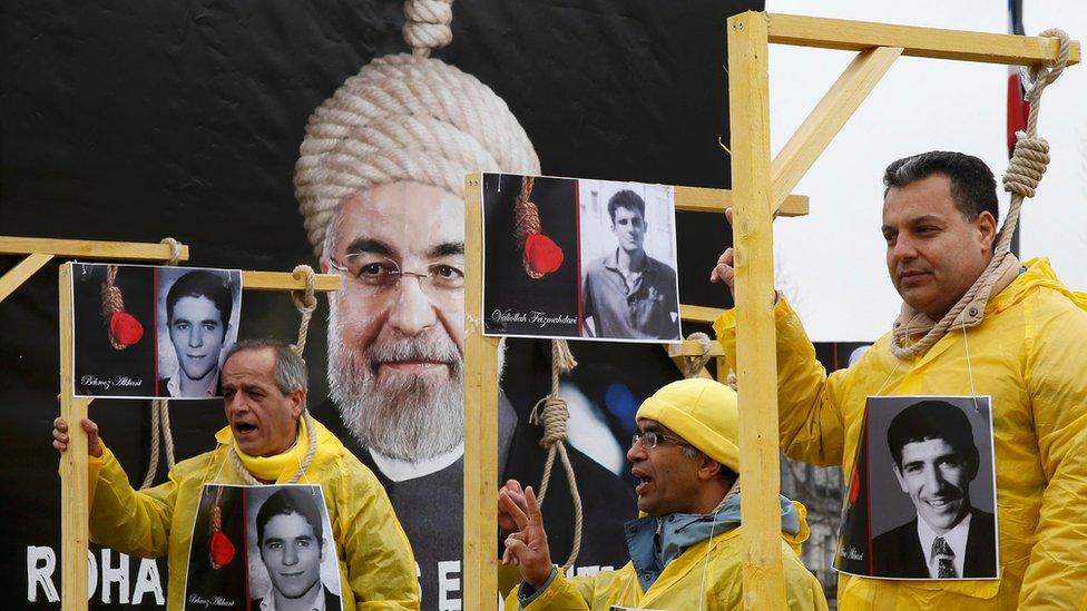 MEK supporters take part in a protest against Iran's President Hassan Rouhani visit to France in central Paris, France, January 28, 2016