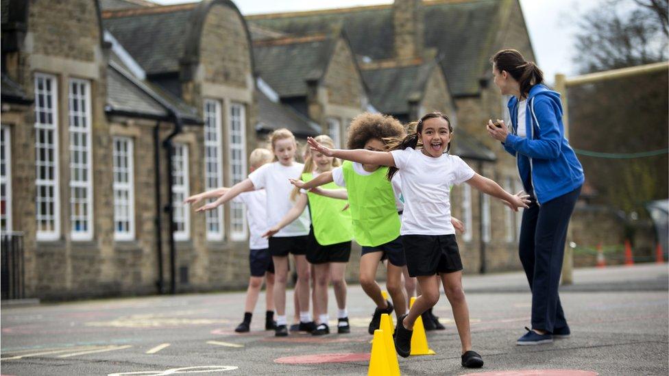 Children playing in PE Kit