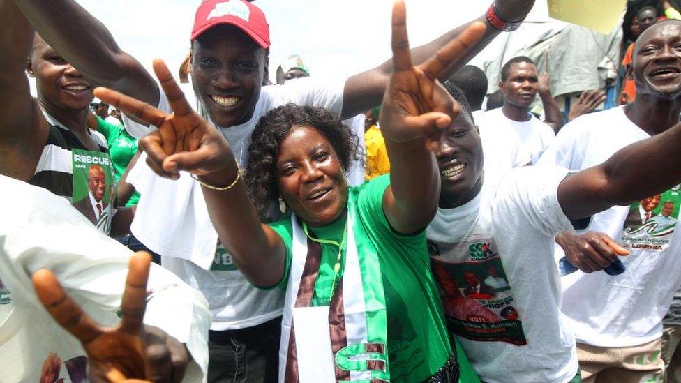 Supporters of the opposition Unity Party (UP) cheer during a campaign rally parade on streets in Monrovia, Liberia, 07 October 2023