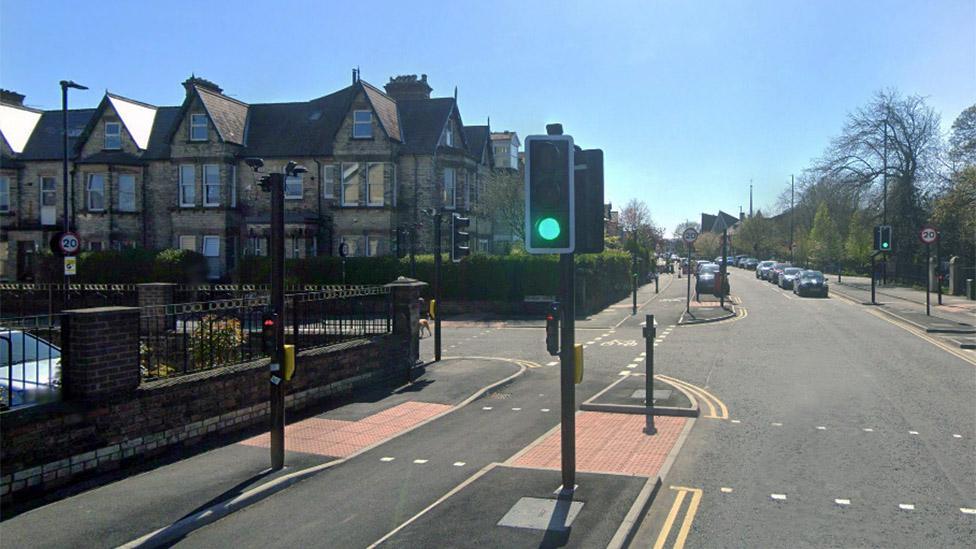 Traffic lights showing green with cycle lane lights on red