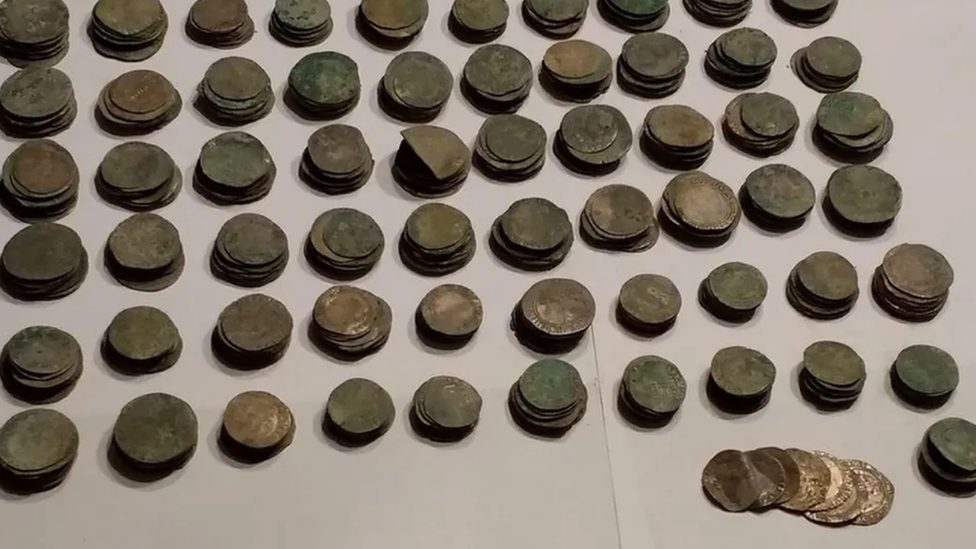 Coin hoard laid out