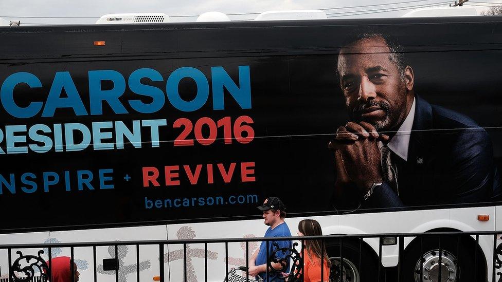 Republican presidential candidate Ben Carson visits voters in a restaurant during the Republican presidential primary on February 20, 2016 in Spartanburg, South Carolina