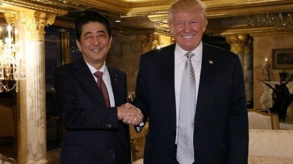 Prime Minister Abe and President Trump, the new US president, at Trump Tower in New York