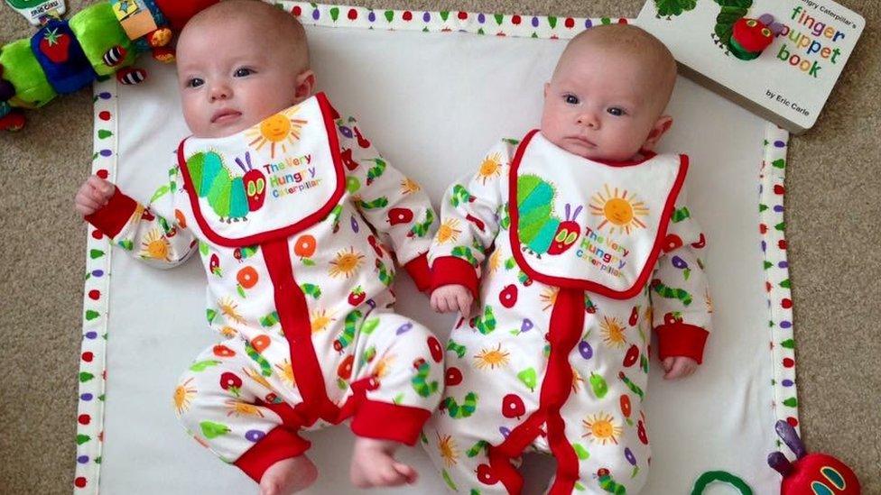 three-month-old twin sisters, Lucy and Freya