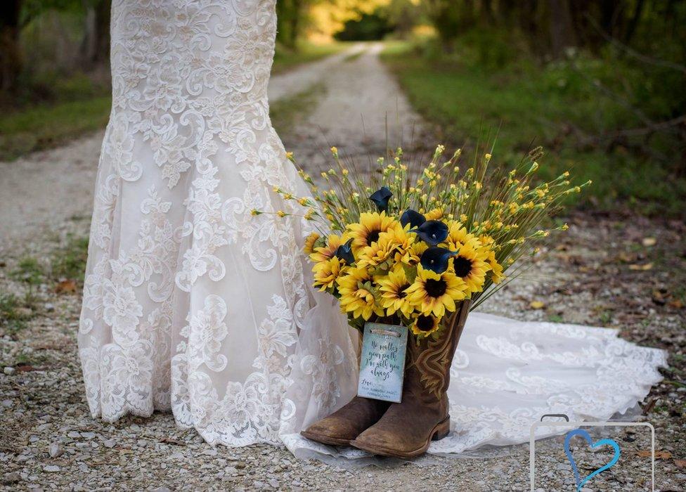 Jessica standing with Kendall's boots