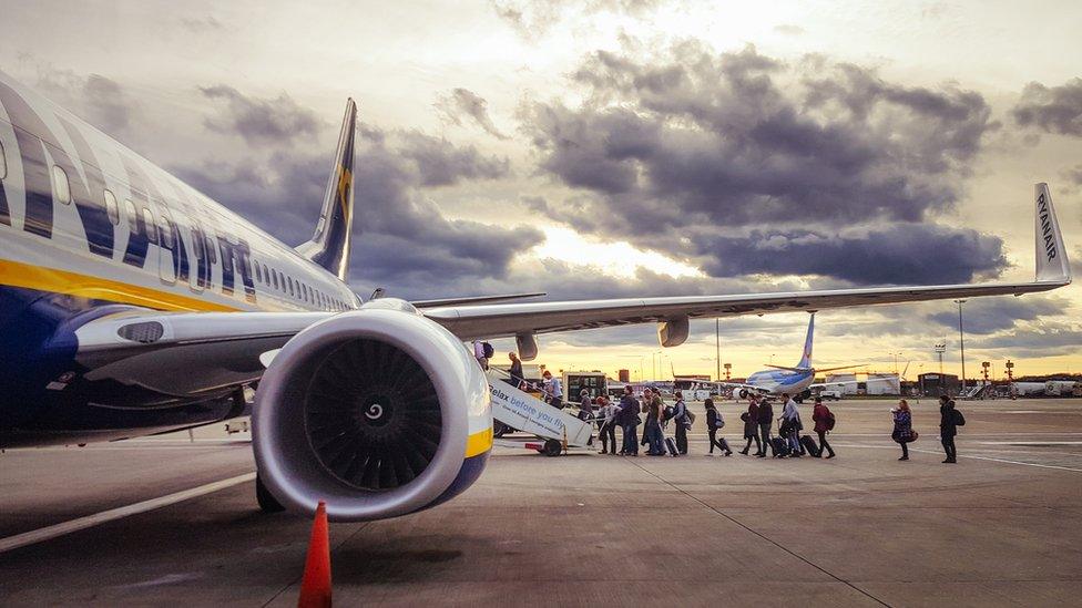 Passengers getting on flight at Edinburgh Airport