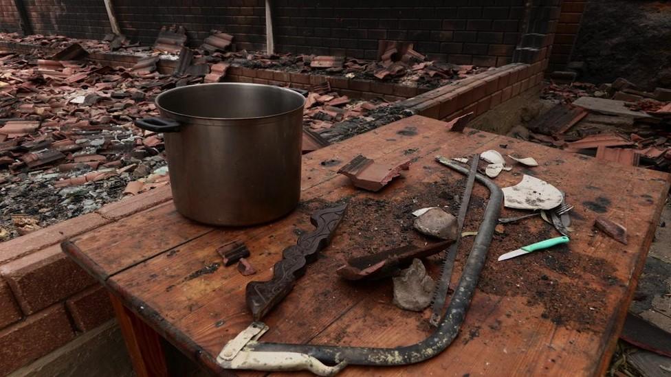 A saucepan can be seen among the remains of El Selmi's burnt up restaurant