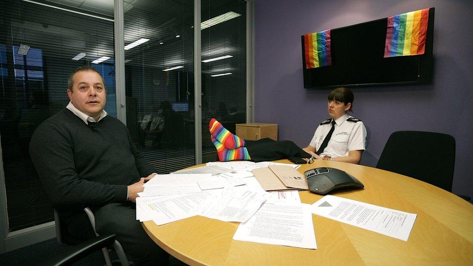 A still from the video showing two people sitting at a table