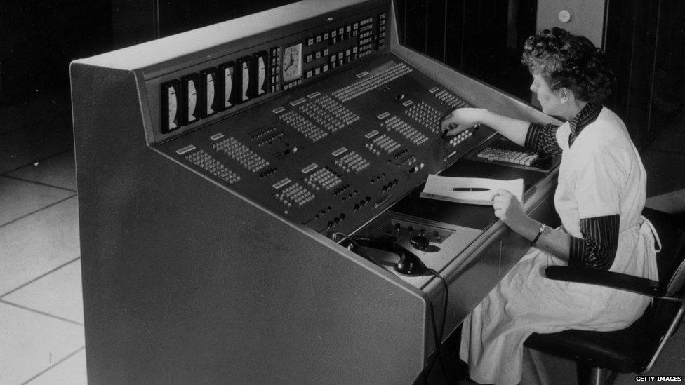 Woman operating an electronic brain