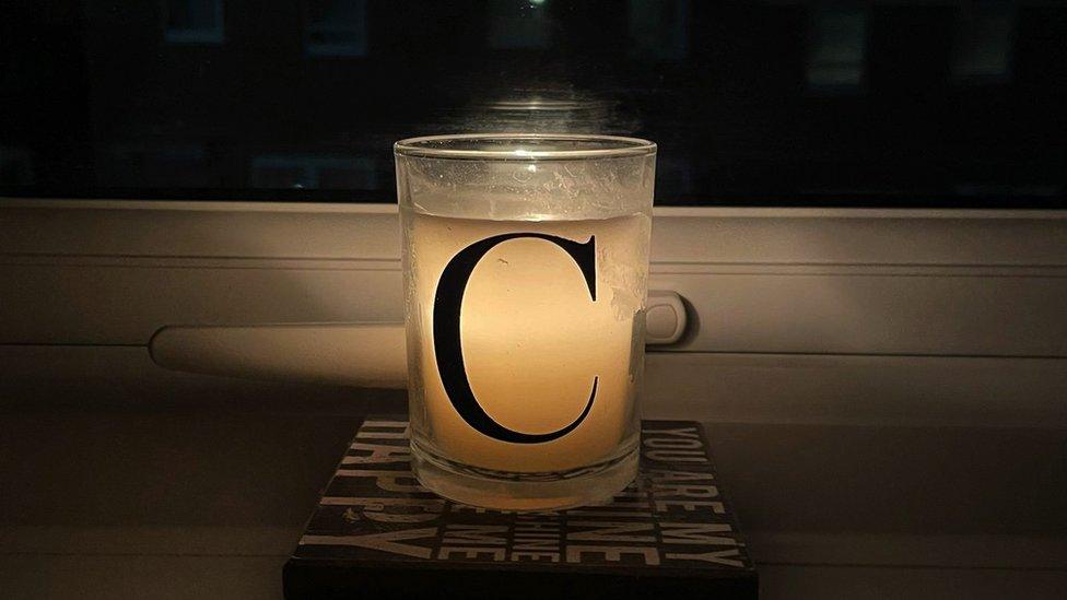 A candle in a window