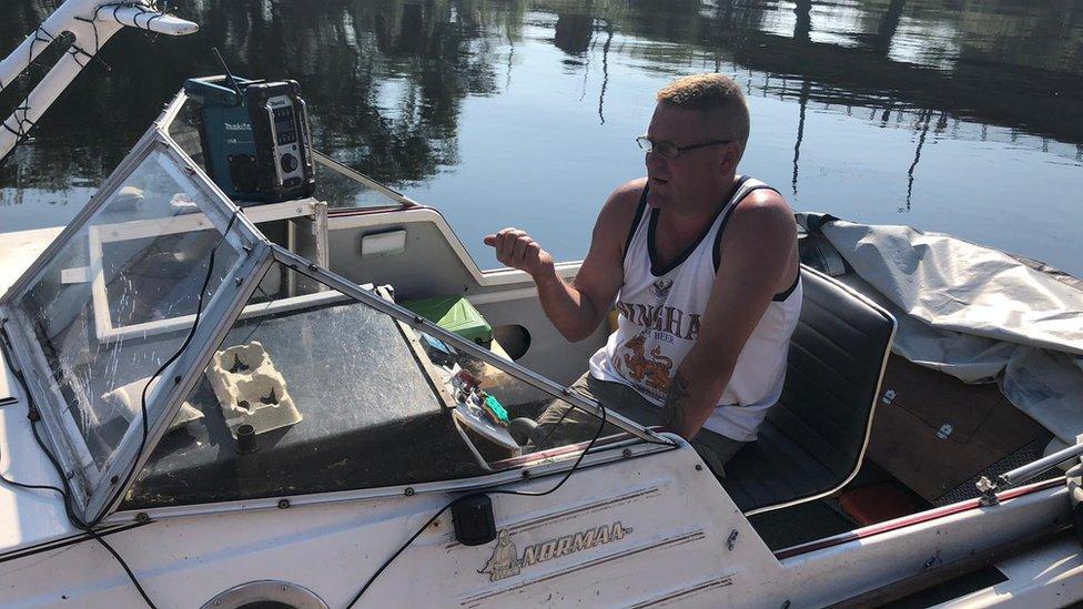 Paul Smith in a boat