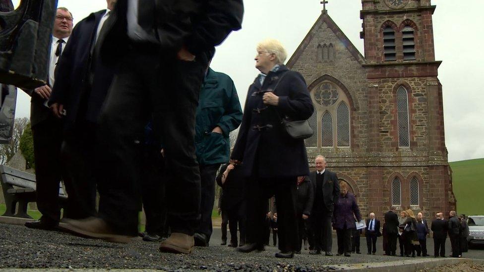 Mourners at service