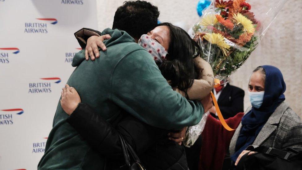 Couples and families are re-united as passengers arrive from the first British Airways flight to arrive since the US lifted pandemic travel restrictions on November 08, 2021 in New York City