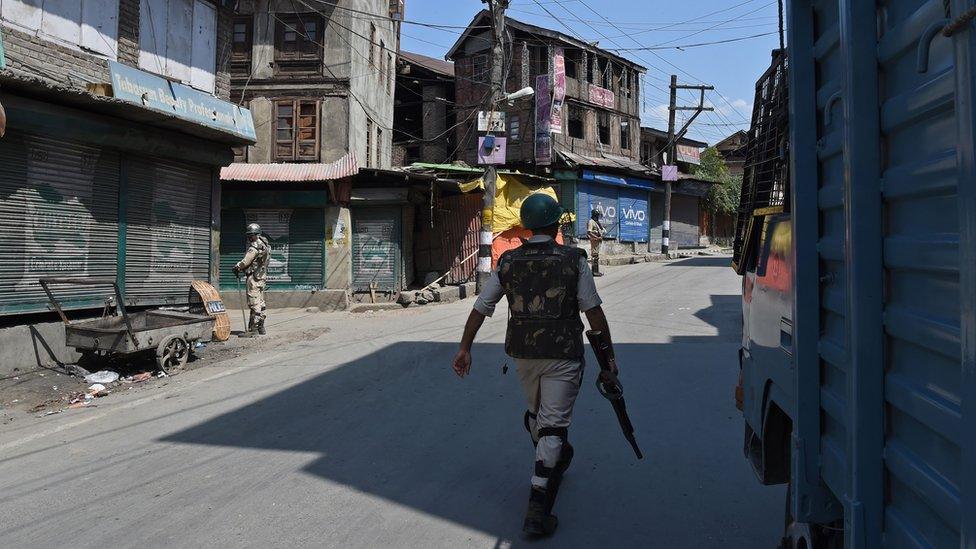 Indian paramilitary troopers patrol near the Jamia Masjid mosque in Srinagar on September 15, 2017