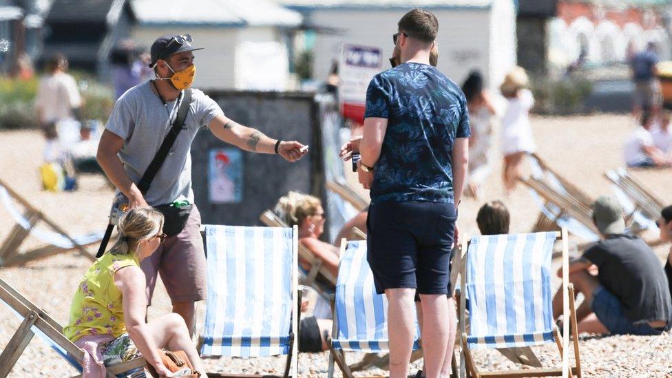 People in face masks at Brighton Beach