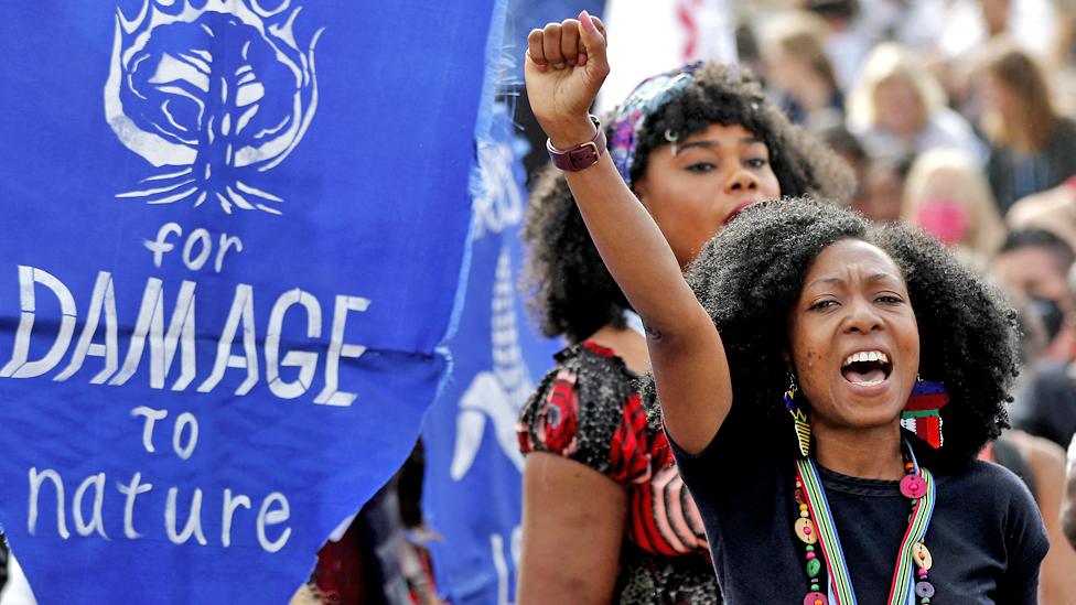 Climate activists protest outside the Sharm el-Sheikh International Convention Centre, during the COP27 climate conference in Egypt's Red Sea resort city of the same name, on 17 November 2022