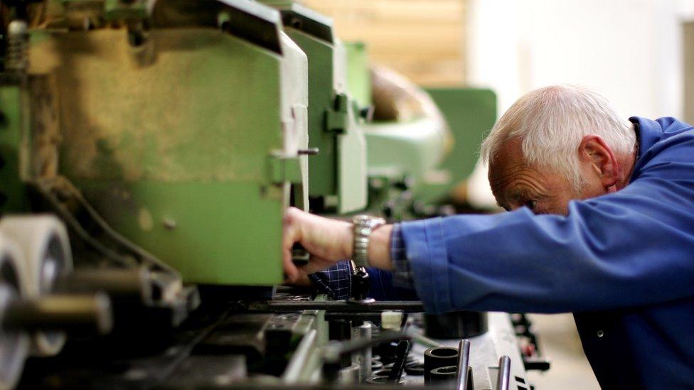 Worker on factory machine