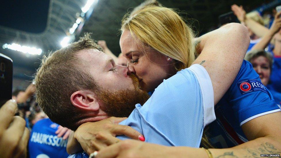 Iceland player Aron Gunnarsson kisses his girlfriend