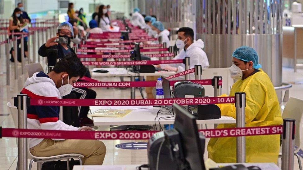 Tourists are tested for Covid-19 on arrival at Dubai's international airport (July 2020)