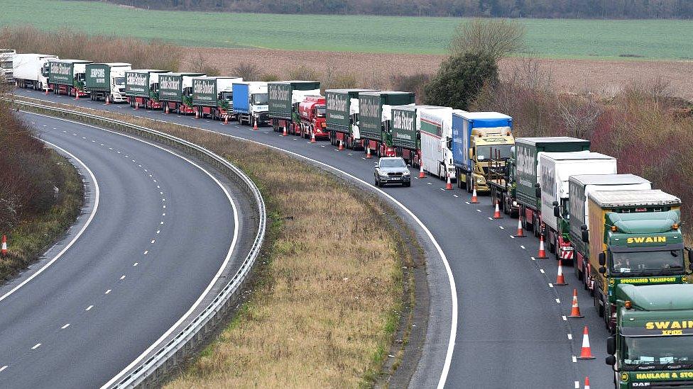 queue of lorries in traffic