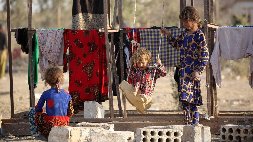 Children play at a refugee camp housing Iraqi families who fled fighting in the Mosul area