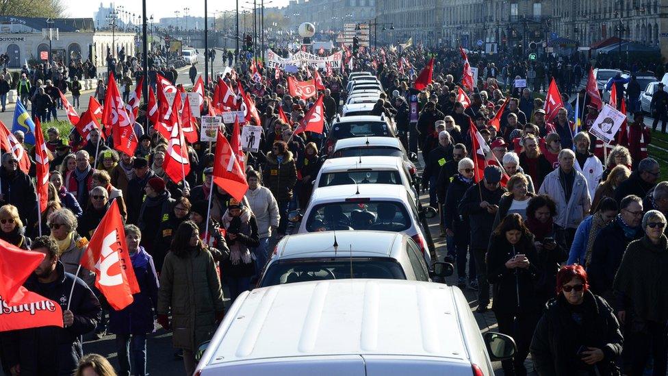 Protesters participate in a demonstration against pension reforms in Bordeaux, France, 05 December 2019.