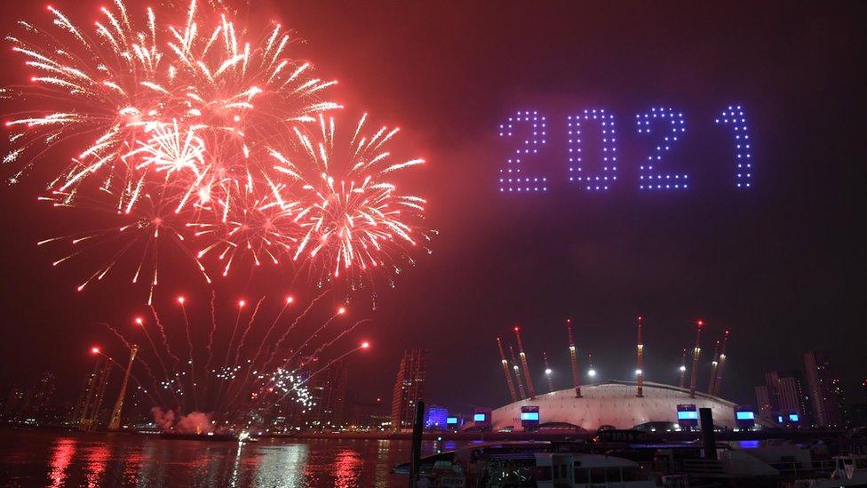 Fireworks above London saying 2021