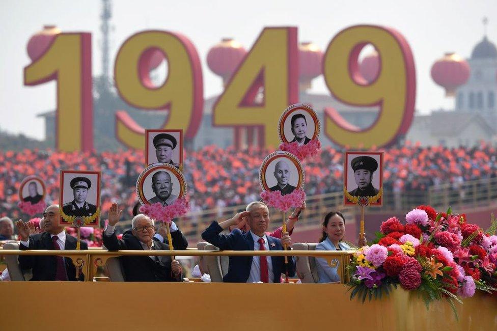 Relatives of revolutionary martyrs take part in the National Day parade in Tiananmen Square in Beijing on October 1, 2019, to mark the 70th anniversary of the founding of the People's Republic of China.